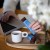 Baton Café-Tasse karmel solony podany z kawą – deserowa przekąska premium